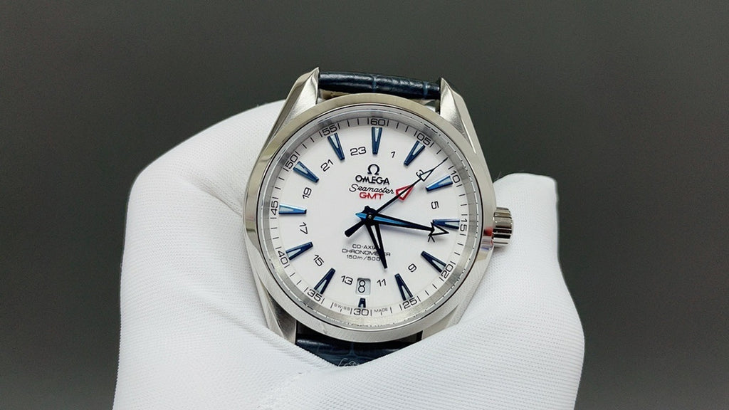 Wristwatch with white dial and blue leather strap, silver case and red accents