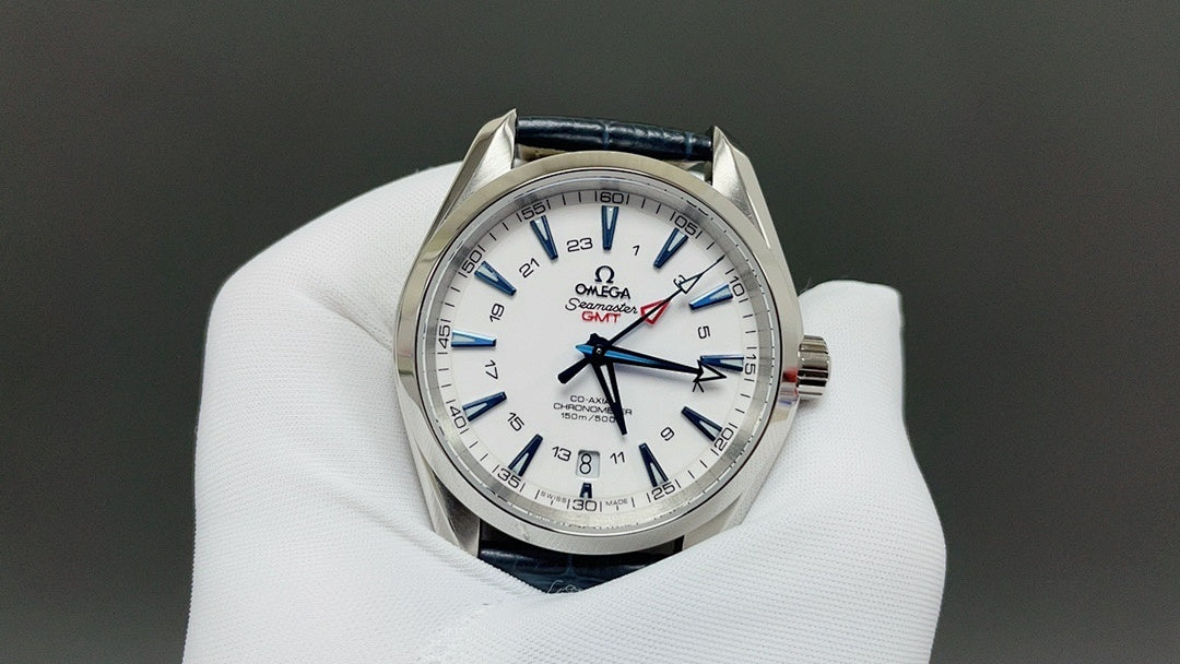 Wristwatch with white dial and blue leather strap, silver case and red accents