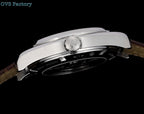 Omega Seamaster watch top profile, silver bezel and crown, brown leather strap.