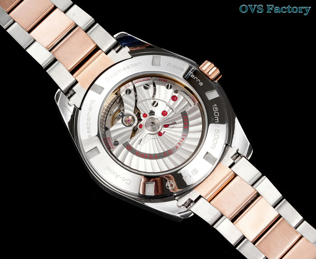 Omega watch close-up with rose-gold dial accents, steel case, mixed metal bracelet
