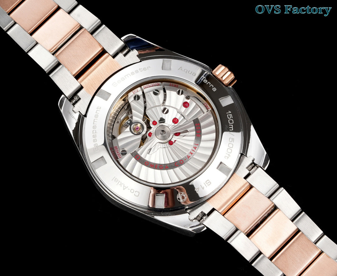 Omega watch close-up with rose-gold dial accents, steel case, mixed metal bracelet