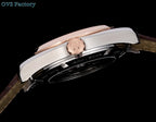 Wristwatch with rose-gold crown and silver case back, brown leather strap