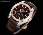 Round wristwatch with brown leather strap and rose-gold bezel, angled view of dial