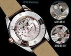 Leather strap wristwatch with exposed movement, silver case and rose-gold bezel