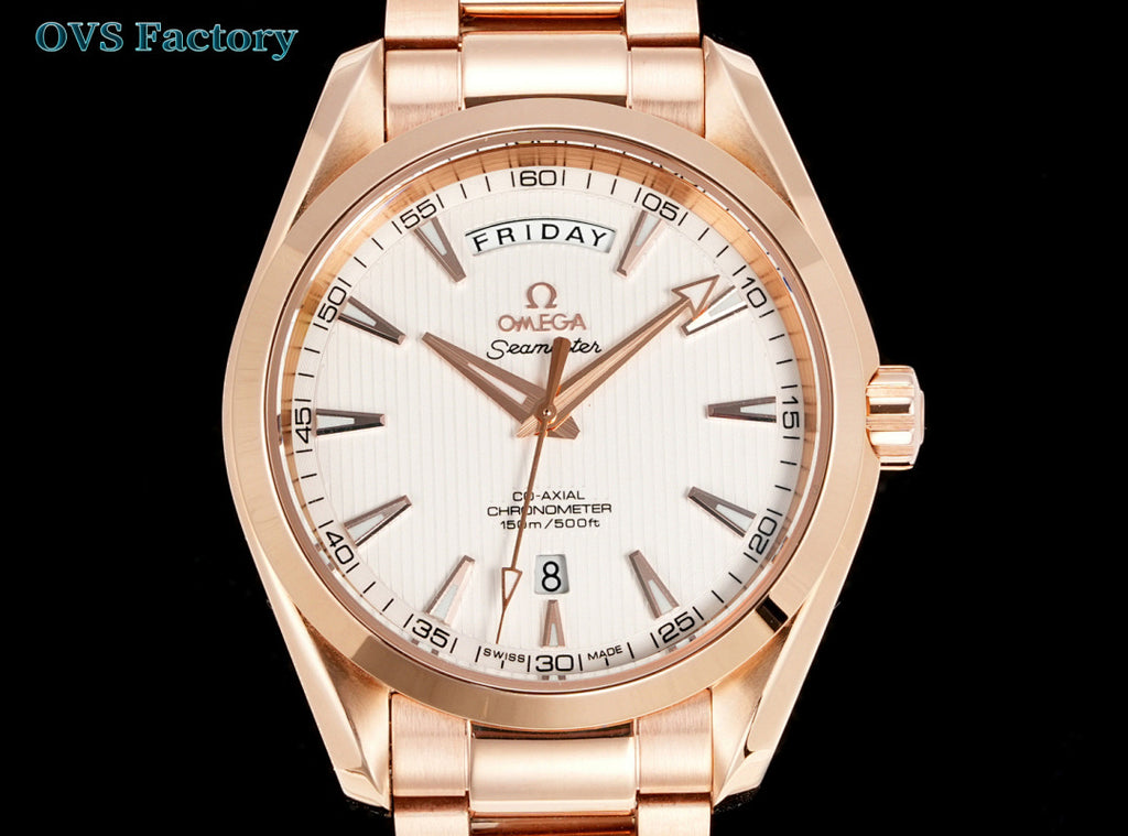Rose-gold tone wristwatch with white dial, gold markers, and day-date window