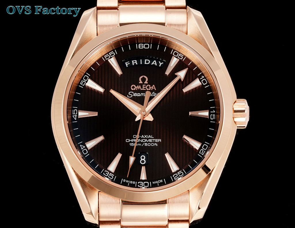 Rose-gold tone wristwatch with black dial, gold markers, and day-date window