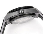 Omega watch close-up showing bezel and Ω marker above the crystal