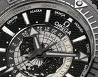 Omega watch dial close-up with world-time ring markings and black subdials