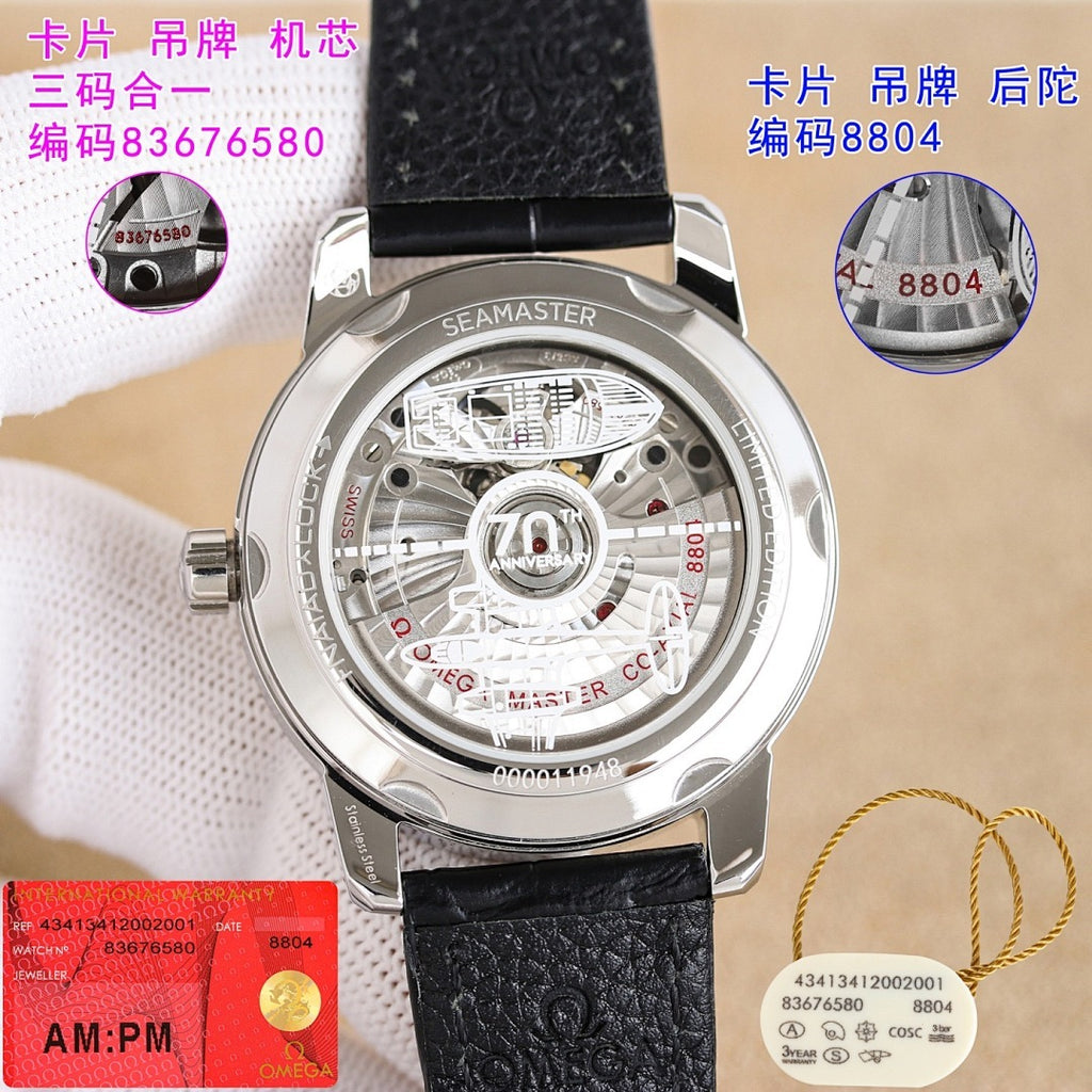 Stainless steel watch caseback on black leather strap, visible mechanical movement