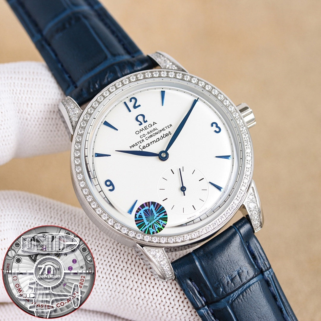 Silver analog wristwatch with diamond bezel, white dial, blue leather strap