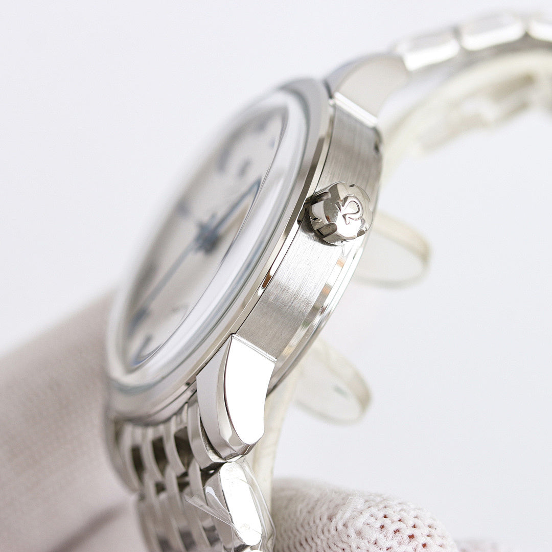 Seamaster wristwatch case with crown and polished silver finish on a metal bracelet