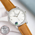 Omega Seamaster watch with white dial, diamond bezel, brown leather strap