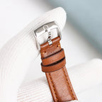 Omega Seamaster watch case underside with brown leather strap