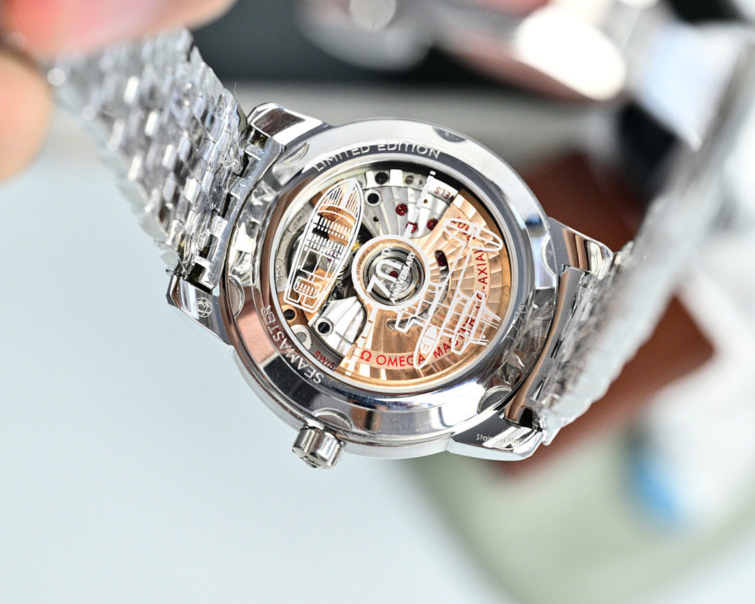 Silver wristwatch case back with detailed engravings, metal bracelet