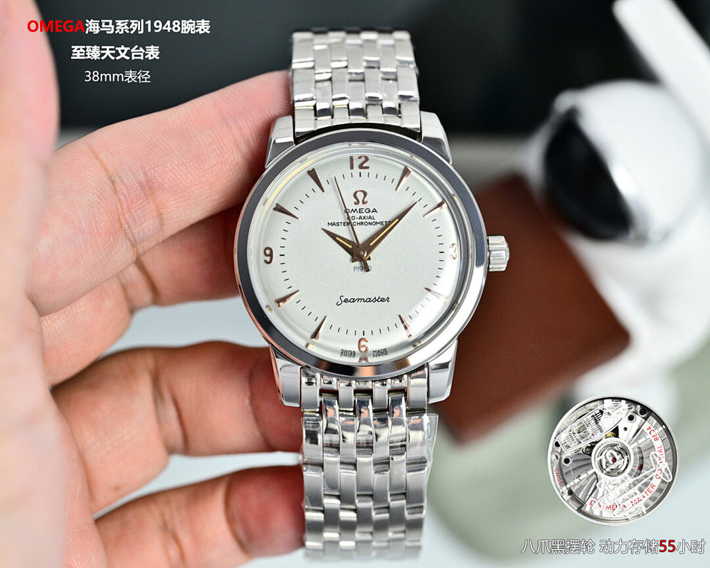 Silver Omega-style wristwatch with white dial, gold hands, and metal link bracelet