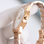 Omega Seamaster watch with rose-gold case and bracelet, side profile