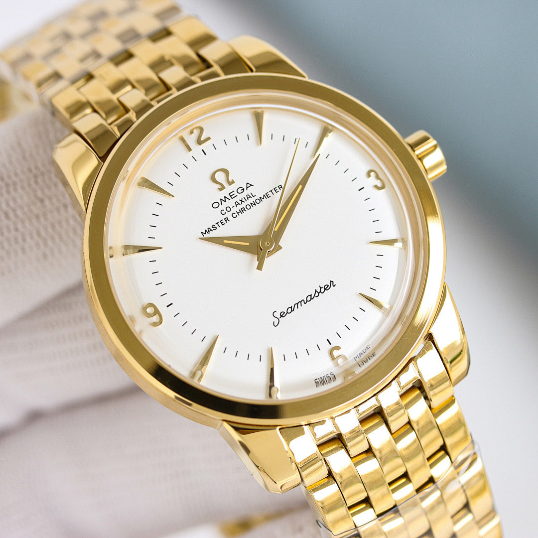 Omega Seamaster watch close-up with gold case, white dial, and gold bracelet