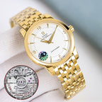 Omega Seamaster watch with gold bracelet, white dial, and caseback disc insert