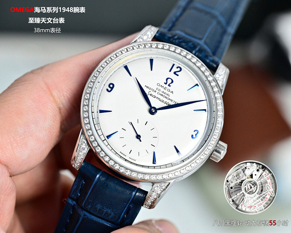 Omega Seamaster watch with blue leather strap, jeweled bezel, white dial, subdials