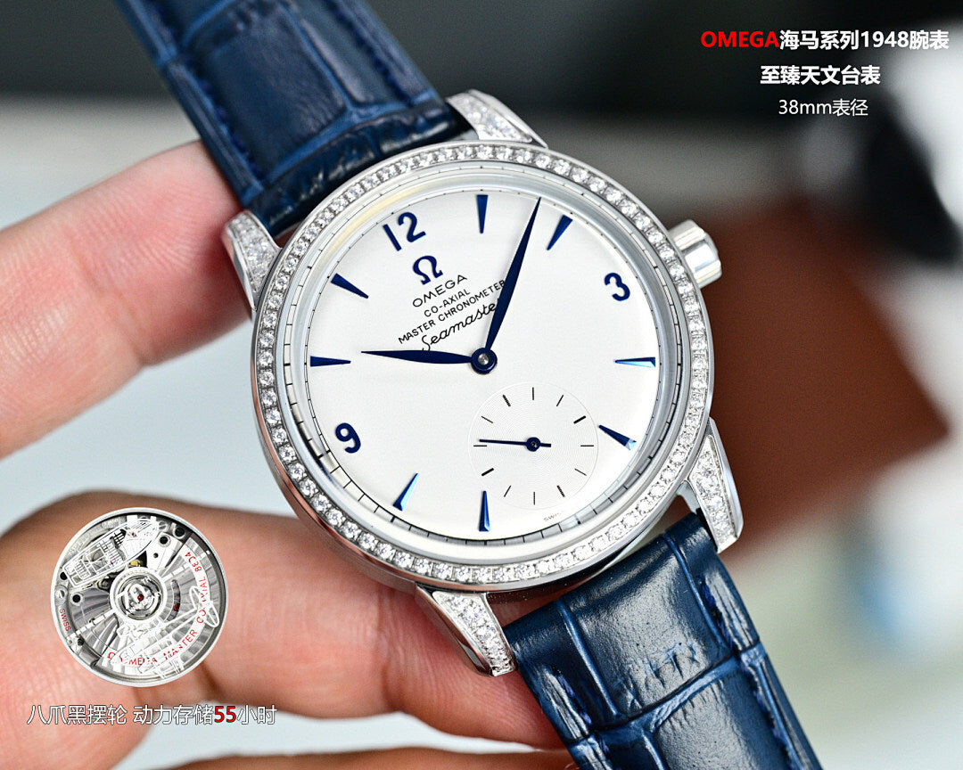 Omega Seamaster watch with blue leather strap, jeweled silver bezel, white dial