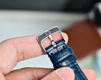 Omega Seamaster leather strap with blue tone, silver buckle clasp on hand