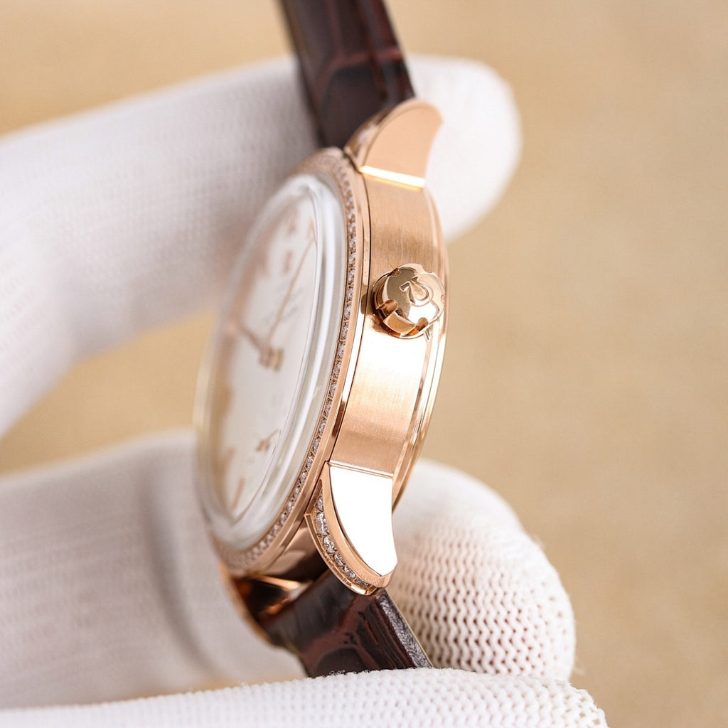 Rose-gold watch side profile with white dial and brown leather strap