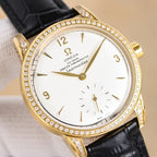 Gold-tone Seamaster watch with white dial, diamond bezel, black leather strap
