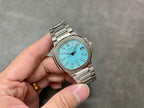 Patek Philippe wristwatch with light blue dial and silver-tone bracelet, angled view