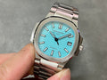 Patek Philippe wristwatch with light blue dial, silver-tone metal bracelet, baton hour markers