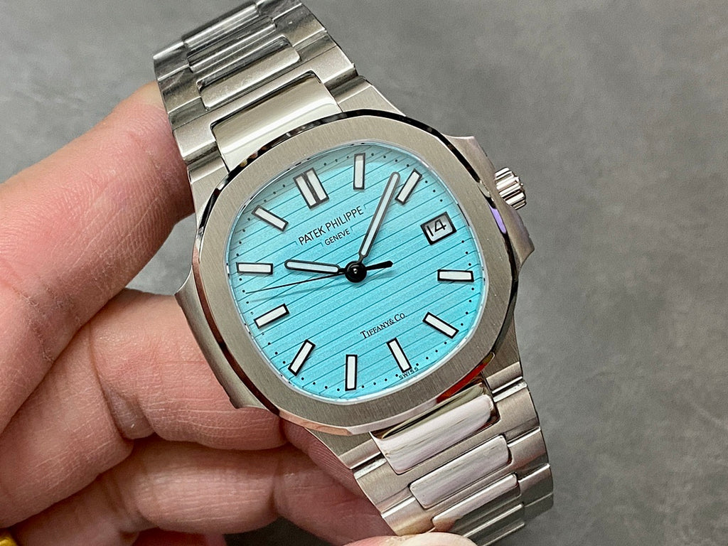 Patek Philippe wristwatch with light blue dial, silver-tone bracelet, roman numeral hour markers