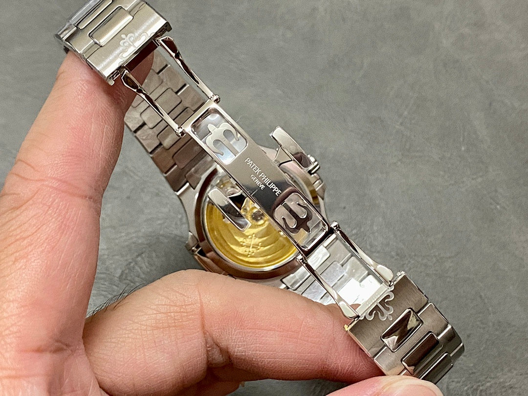 Wristwatch bracelet clasp underside with metal links and engraved logo
