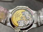 Wristwatch open caseback showing gold-toned rotor and visible mechanical components