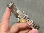 Patek Philippe wristwatch clasp and bracelet underside in silver metal.