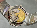 Patek Philippe wristwatch open case back with gold-toned movement.
