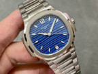 Patek Philippe wristwatch close-up with blue dial and silver hands.