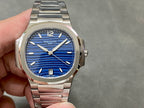 Patek Philippe wristwatch with blue dial and stainless steel bracelet.