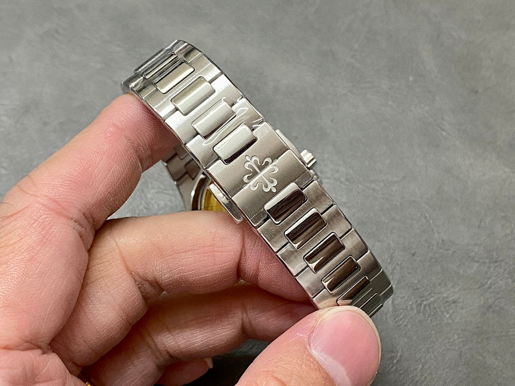 Patek Philippe wristwatch bracelet segment with metal links and clasp, brushed and polished finish