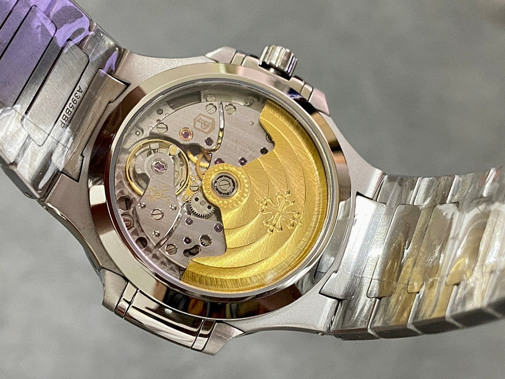 Patek Philippe wristwatch with exposed mechanical movement, gold-toned rotor, stainless bracelet
