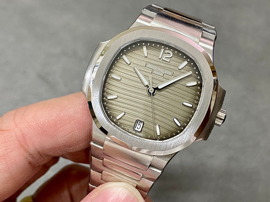 Patek Philippe wristwatch with silver dial, baton markers, date window, stainless bracelet