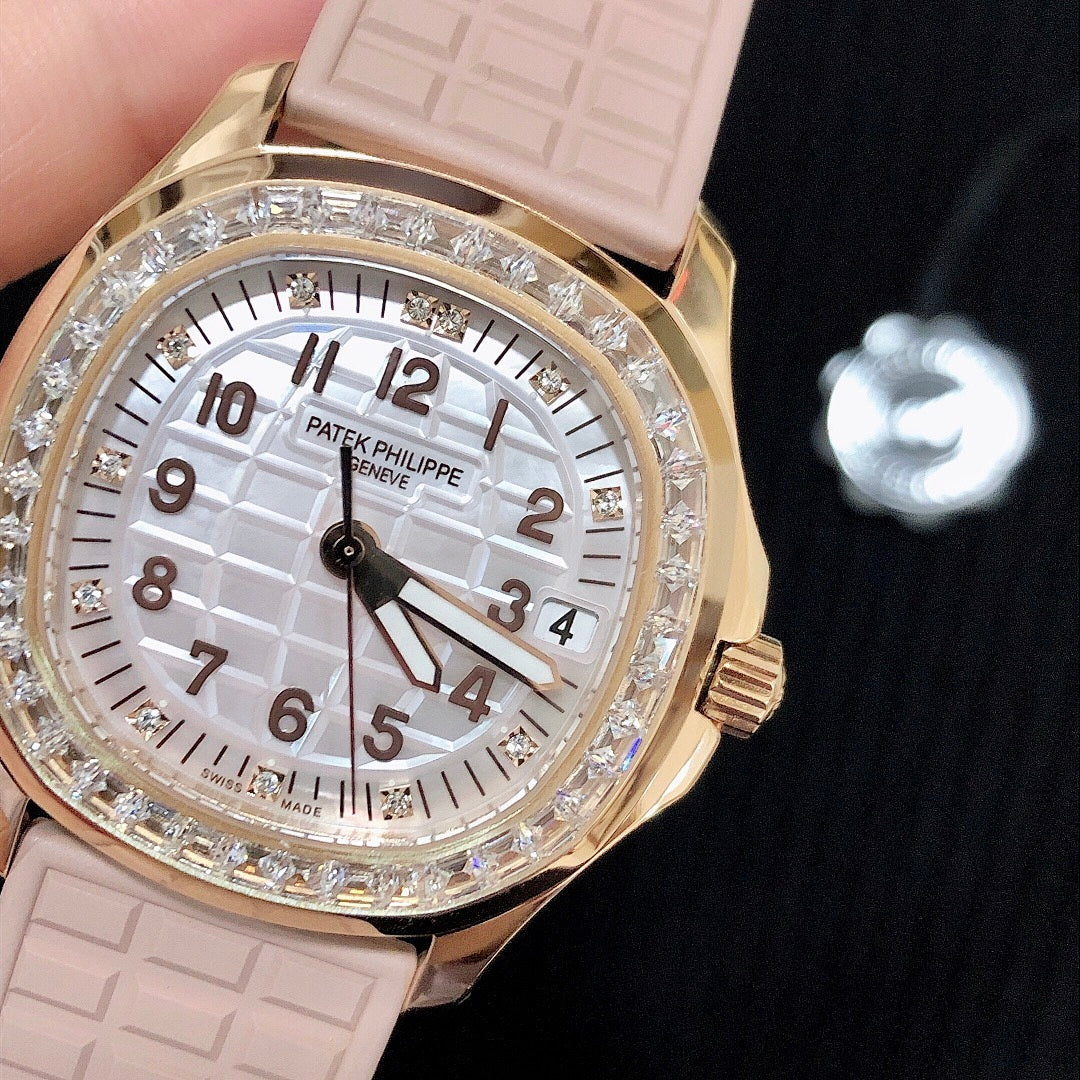 Patek Philippe watch close-up with pink strap, white dial, and diamond-set bezel