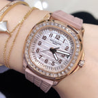 Patek Philippe watch with pink silicone strap, rose-gold case, diamond bezel, white dial
