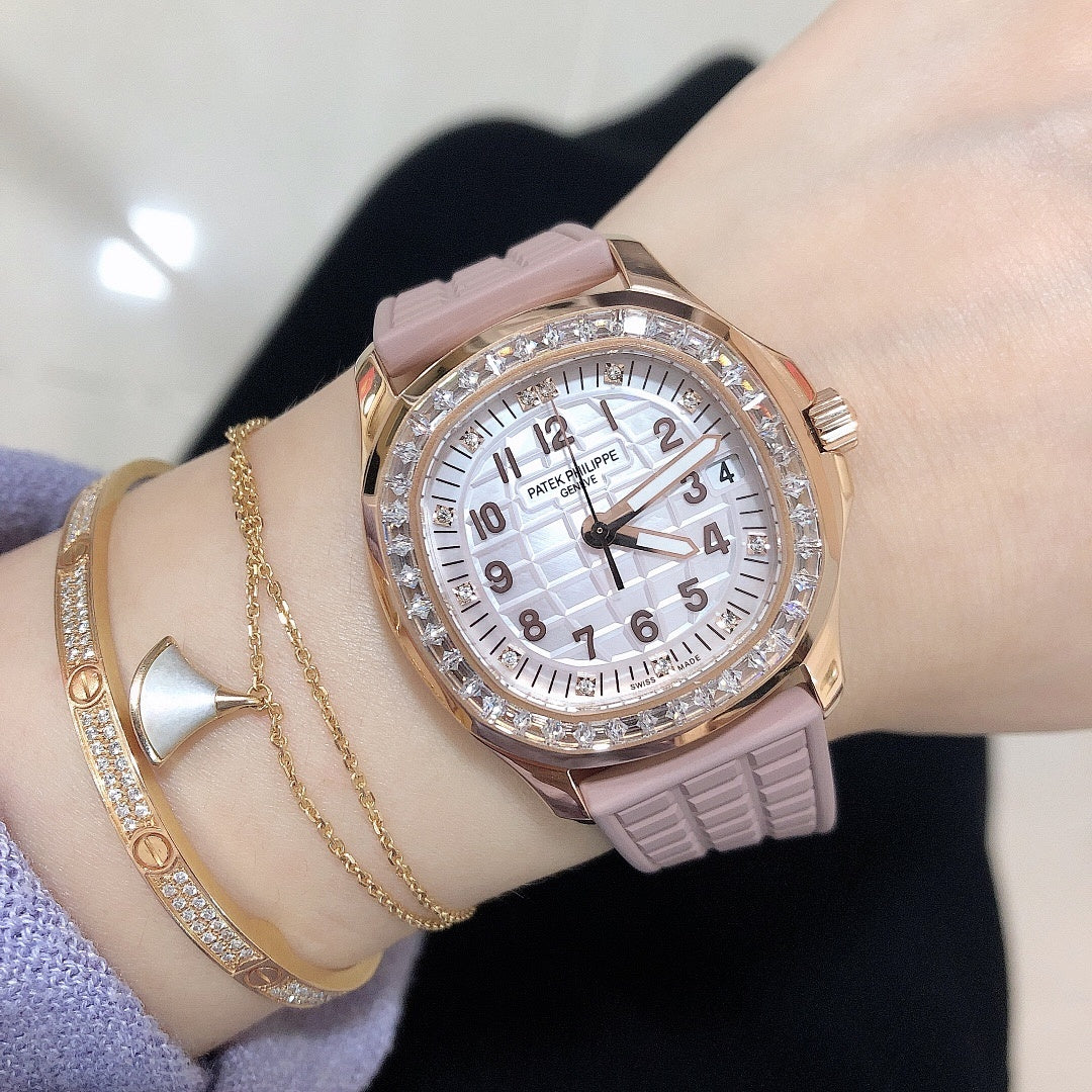 Patek Philippe watch featuring a pink textured strap, rose-gold case, and diamond bezel