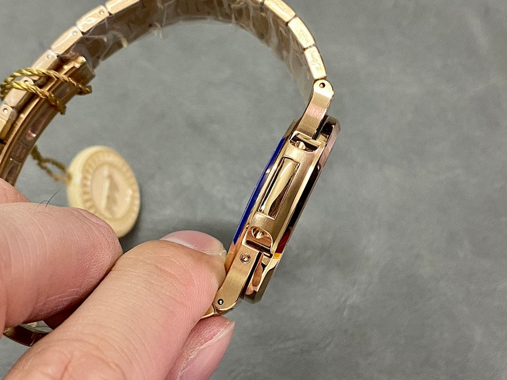 Gold-tone watch bracelet side profile with clasp and links