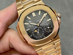 Gold-tone wristwatch close-up of black dial, gold hands and subdials
