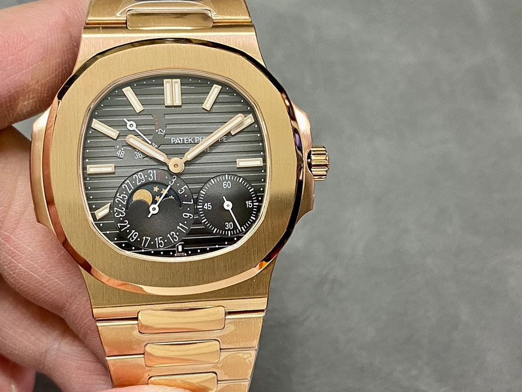 Gold-tone wristwatch front view, black dial with multiple subdials and gold bezel
