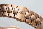 Patek Philippe rose-gold tone metal bracelet with engraved clasp center link