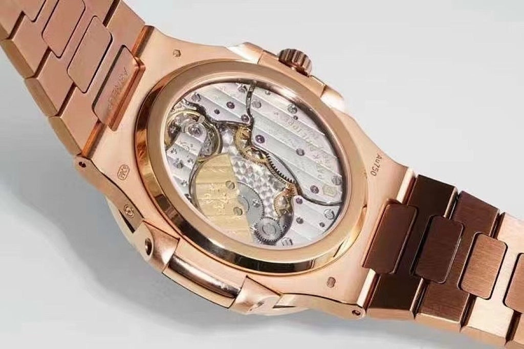 Patek Philippe rose-gold wristwatch with exhibition caseback and visible mechanical movement