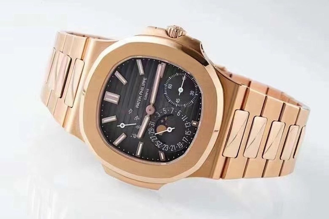 Patek Philippe rose-gold tone wristwatch with black dial and multi-link metal bracelet