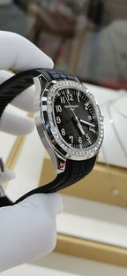 Patek Philippe wristwatch angled view with black dial and diamond-studded bezel