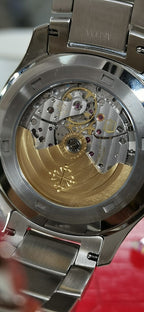 Luxury watch case with exposed mechanical movement and metal back